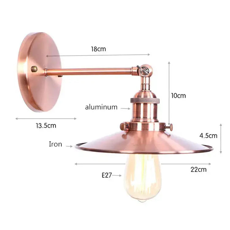 Copper-finished industrial vintage wall sconce with brass iron base and aluminum arm featuring exposed edison bulb