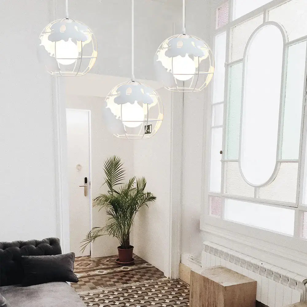 Three white metal pendant lights with cloud-shaped cutouts from decorbites industrial vintage loft kitchen globe decor