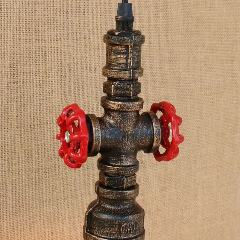 Industrial water pipe pendant light with dark weathered metal body and bright red valve handles for dining room decorbites industrial water