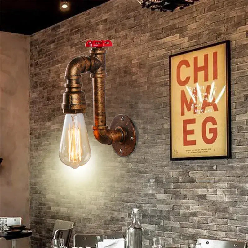 Industrial water pipe wall sconce with brass pipe, red valve, and exposed Edison bulb for corridor decorbites industrial water