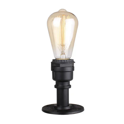 Industrial water pipe wall sconce kitchen light in black and brass with a clear glass bulb and visible filament decorbites industrial water