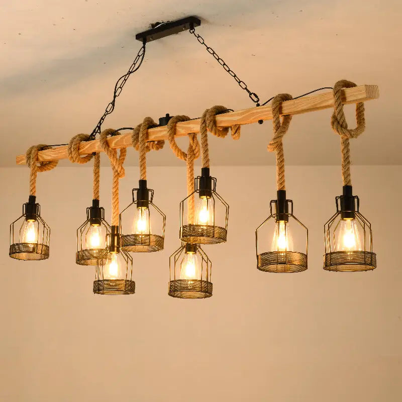 Rustic industrial-style decorbites™ hang-it-out farmhouse pendant lamp with wooden beam, natural rope, and black metal cage lanterns