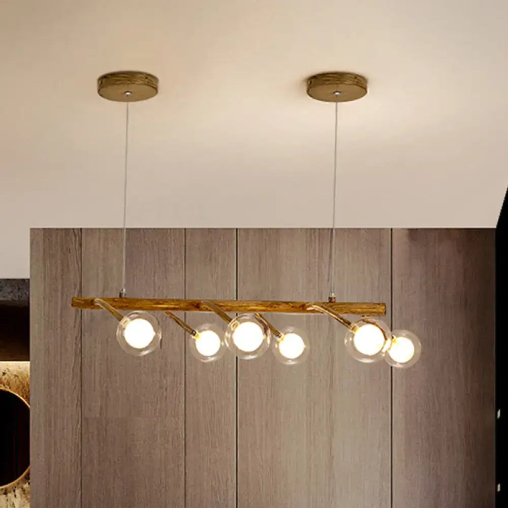 Rustic wooden pendant light with brass accents and modo clear glass shade for dining hall or kitchen island lighting