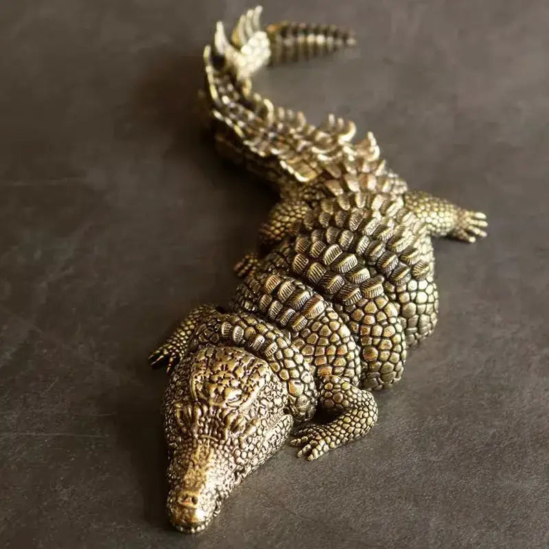 Intricate decorbites brass crocodile sculpture with bronze color and textured scales for living room decor accessory