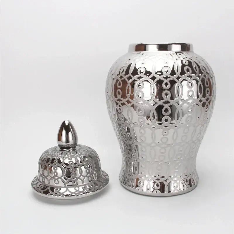 Silver ceramic jar vase with intricate circular cutout patterns and decorbites golden pattern for living room decor