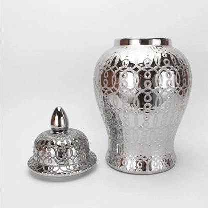 Silver ceramic jar vase with intricate circular cutout patterns and decorbites golden pattern for living room decor