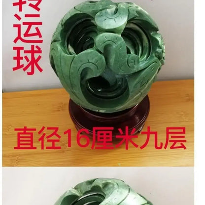 Intricate green jade stone dragon phoenix ball with swirling dragon motifs and layered concentric rings for living room decor