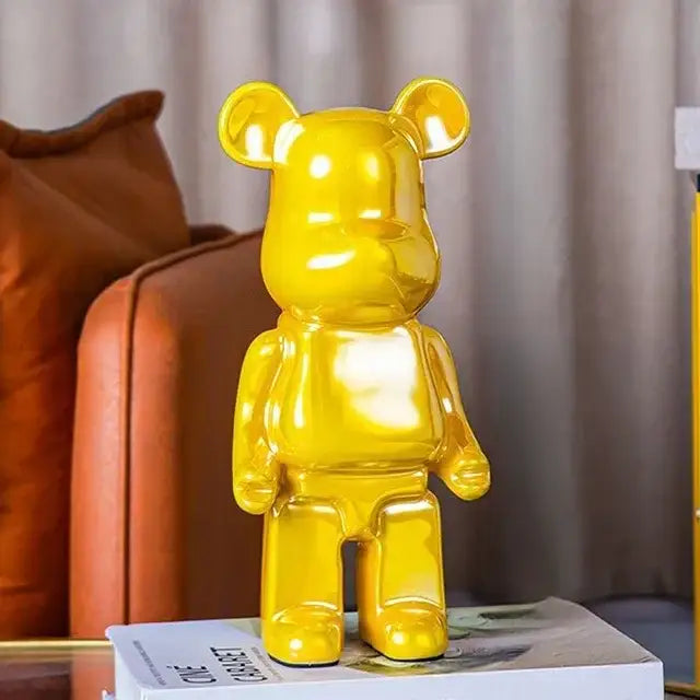 A glossy yellow bearbrick piggy bank with a smooth reflective surface for bear tv cabinet sculpture decor