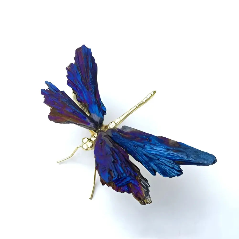 A vibrant blue and purple crystal dragonfly decorative figurine with iridescent wings and gold-toned body for bedroom decor