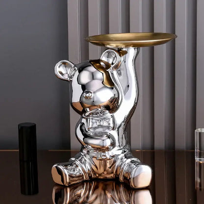 Shiny silver bear figurine holding a gold tray as decorbites colorful bear storage box and living room tray centerpiece