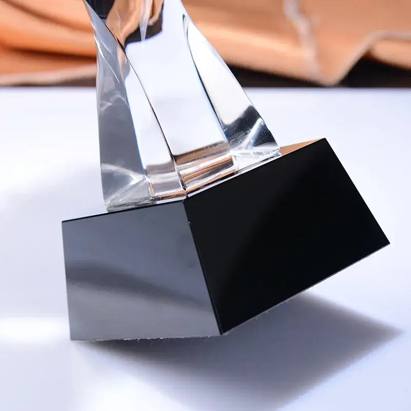 A sleek modern decorbites crystal horse trophy with polished chrome and black mirrored geometric design for living room decor