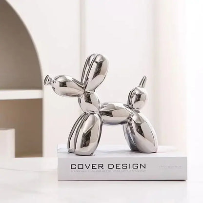Shiny silver balloon dog ceramic sculpture with sleek reflective surfaces and minimalist design for living room decor