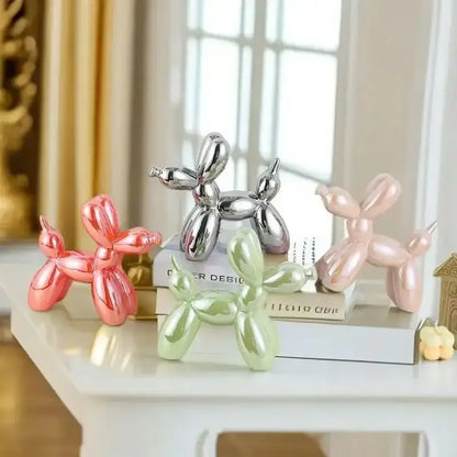 Set of four iridescent glossy balloon dog ceramic sculptures in pink silver and mint green for living room decor