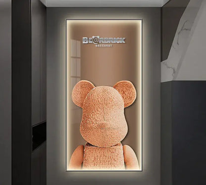 A tan intricately woven bearbrick baccarat collectible displayed in a sleek illuminated led wall lamp for bedroom decor