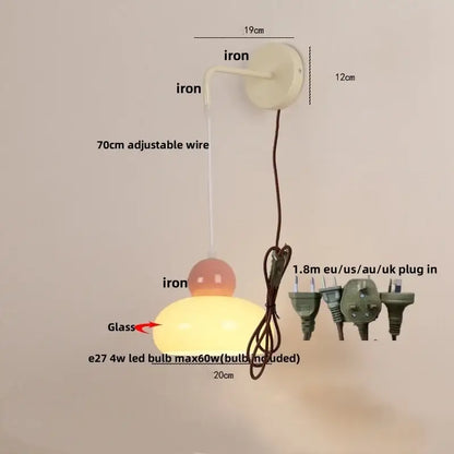 Cream-colored wall light with iron nordic led mounting bracket and glass globe shade for bedroom decorbites iron nordic