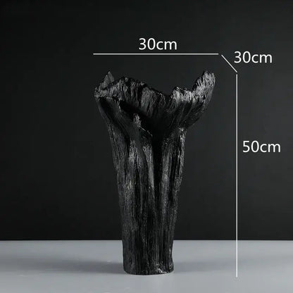 Black irregular resin vase with white textured tree trunk ridges and flared top by decorbites for living room decor