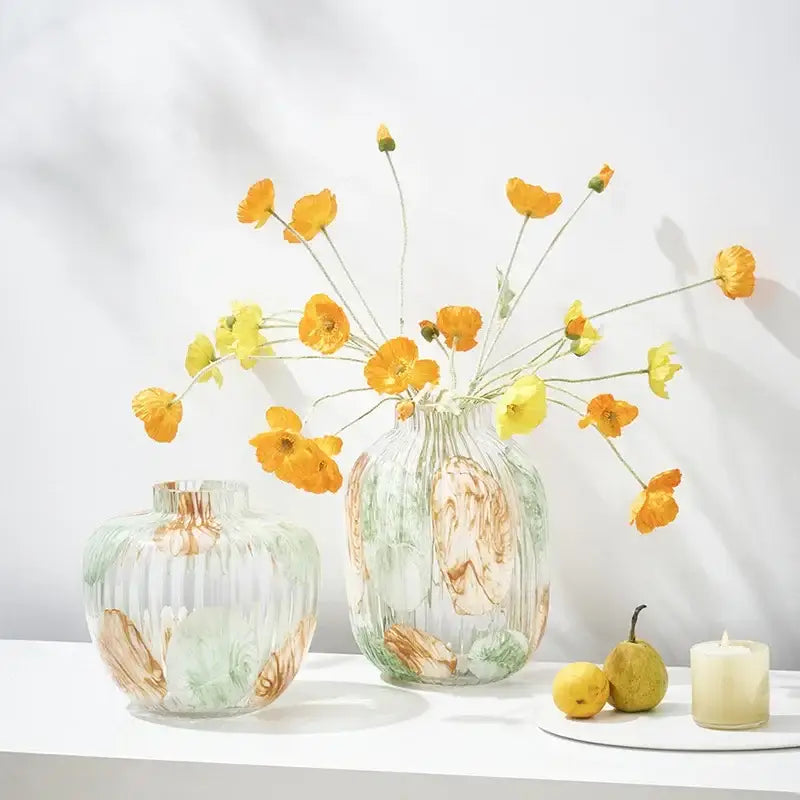 Clear glass vase with irregular ribbed vertical ridges and swirling amber green and white patterns for living room decor