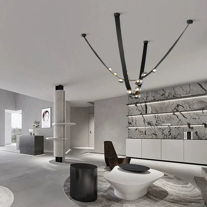Black minimalist chandelier with sleek curved arms and spherical lights in decorbites italian light luxury leather design