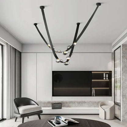 Black metal chandelier with sleek curved arms and spherical glass bulbs for italian light luxury dining room decorbites italian light