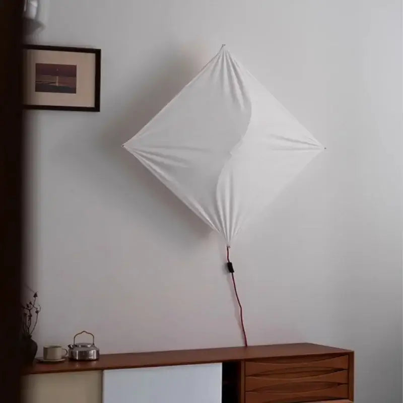 White diamond-shaped italian vintage ceiling light with beige fabric shade and visible red cord for living room decorbites italian vintage