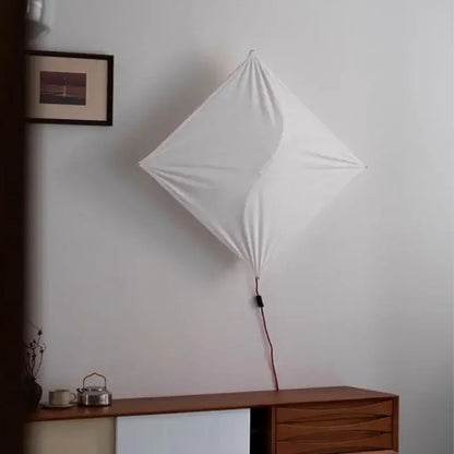 White diamond-shaped italian vintage ceiling light with beige fabric shade and visible red cord for living room decorbites italian vintage