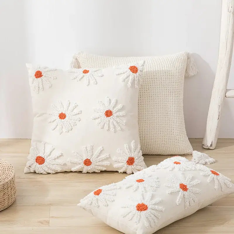 Ivory tufted cushion cover with cream color and white daisy embroidery featuring orange centers for living room decorbites cushion cover