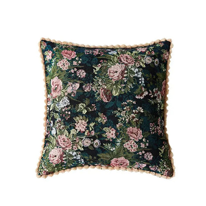 Dark green velvet jacquard farmhouse decor pillow case with intricate pink white floral embroidery and beige fringe trim