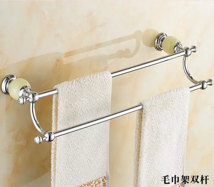 Chrome-finished double-bar towel rack with pale green ceramic knobs and ornate detailing from jade bathroom set by decorbites brass