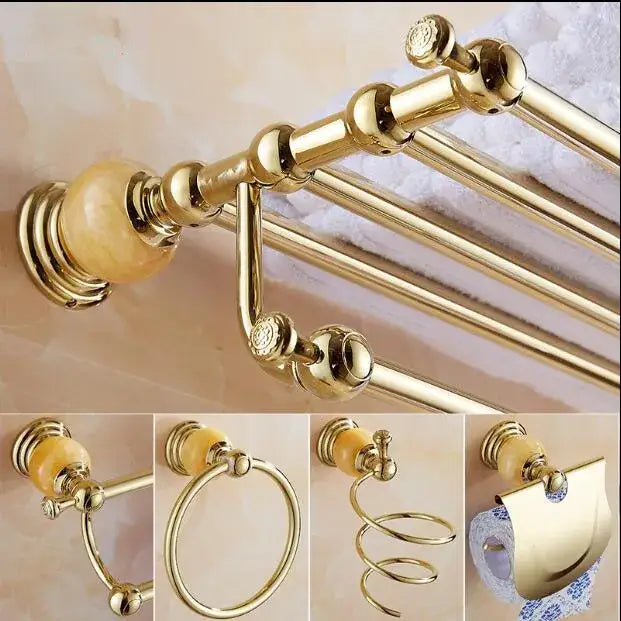 Gold-toned bathroom towel rack with ornate spherical finials and amber marble end in jade gold bathroom accessories set