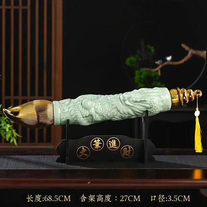 Jade green and gold dragon ceramic wine bottle with celadon brush and intricate carvings displayed on black stand