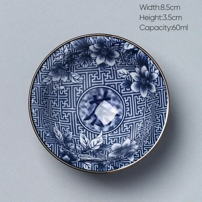 Japanese blue and white porcelain kung fu tea cup with intricate floral patterns and gold-trimmed edge by decorbites ceramic kung