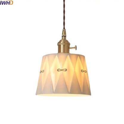 Japanese geometric ceramic led pendant light in warm tones with brass accents and twisted cord for modern decorbites ceramic led decor