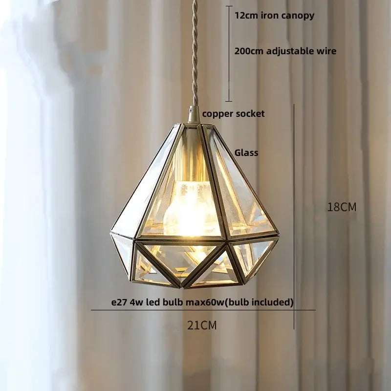 Japanese geometric glass led pendant lamp with brass frame and clear panels suspended by adjustable copper wire