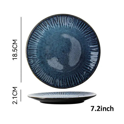 A deep blue textured ceramic dinner plate with a sunburst pattern from decorbites ceramic dinnerware set