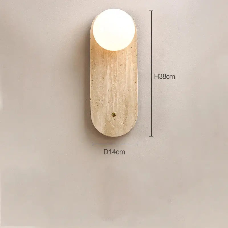 A Japanese minimalist beige cave stone wall lamp with a warm textured base and smooth white head for bedroom decor