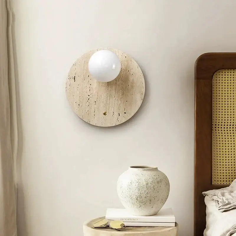 Japanese minimalist beige cave stone wall lamp with round textured base and smooth white bulb for bedroom decorbites cave stone