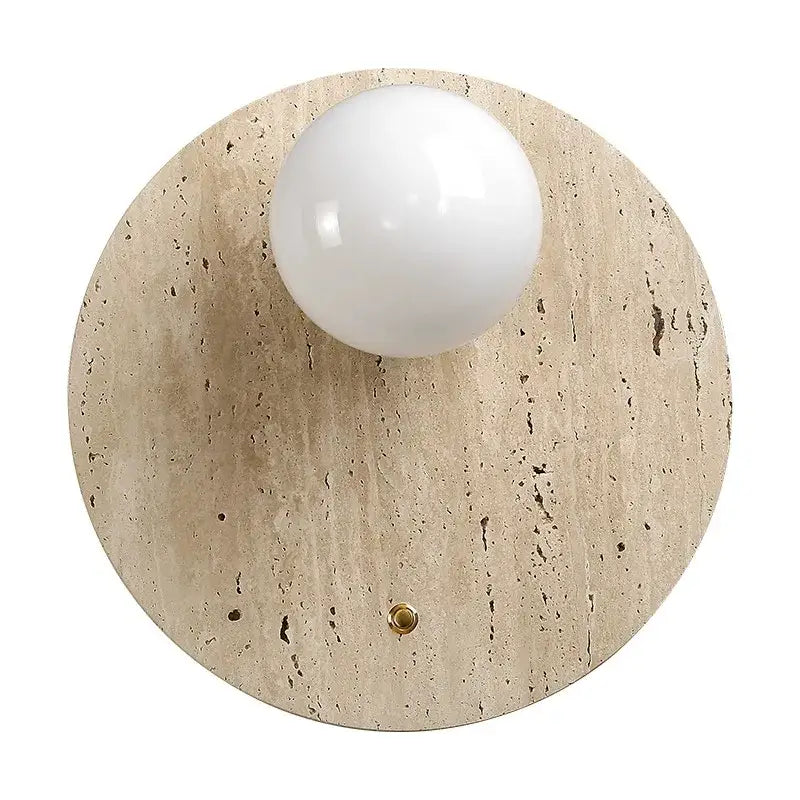A sleek Japanese minimalist beige cave stone wall lamp with textured base and white spherical bulb for bedroom decor