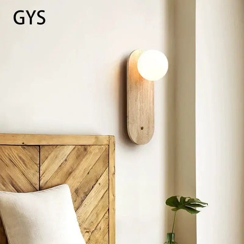 Warm-toned wooden wall lamp with smooth rounded glass globe for bedroom decorbites cave stone wall lighting