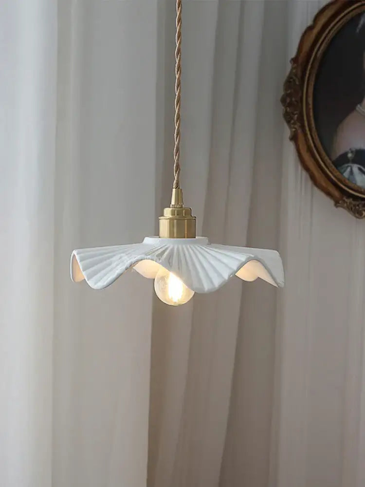 Japanese ribbed white ceramic pendant light with gold-toned brass fixture and petal design for kitchen or dining room