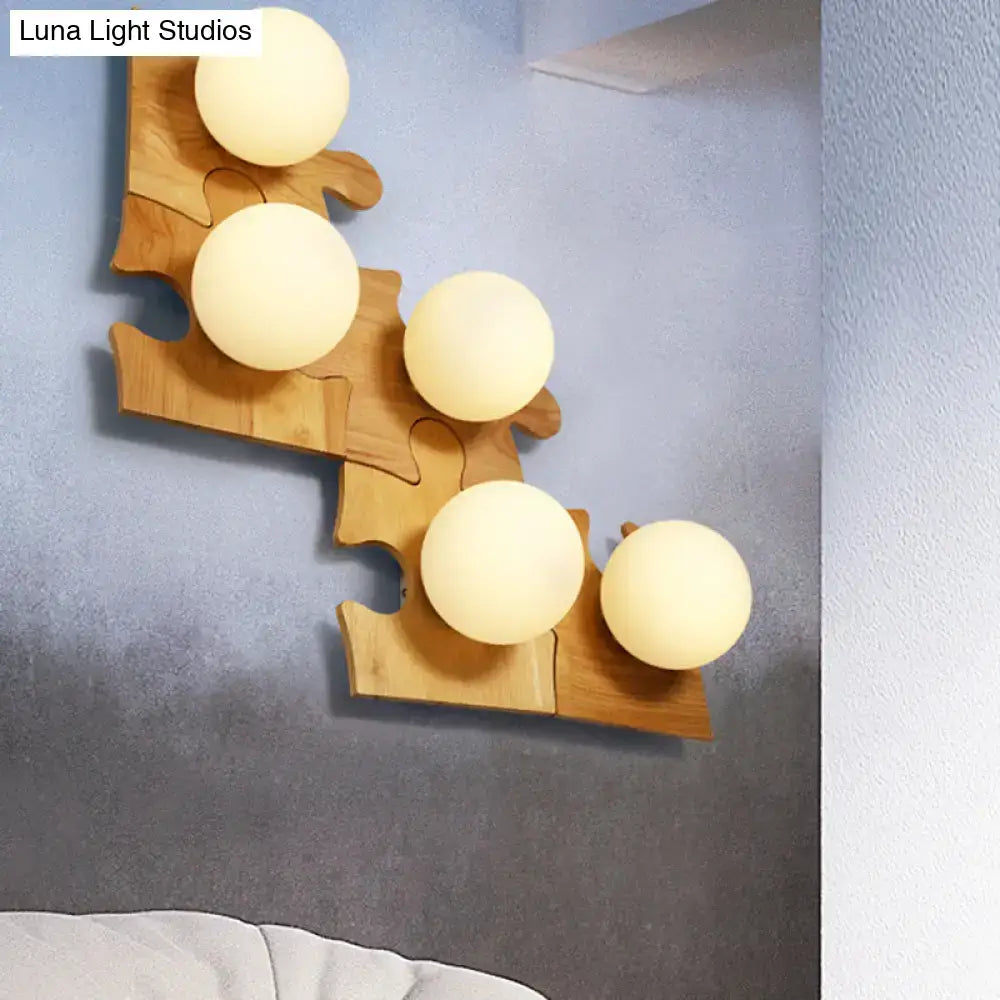Japanese style beige wall light with warm-toned spherical bulbs mounted on a wooden puzzle base for corridor use