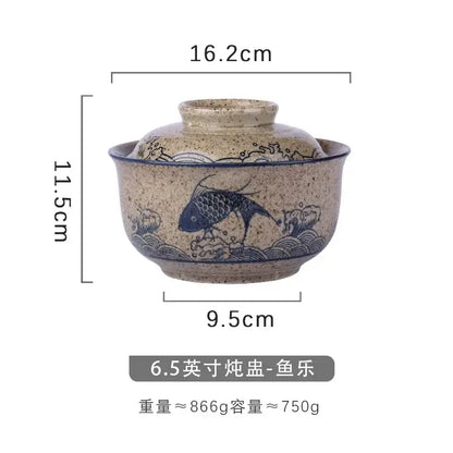 A japanese style ceramic ramen bowl with speckled beige glaze blue hand-painted fish design and attached lid decorbites