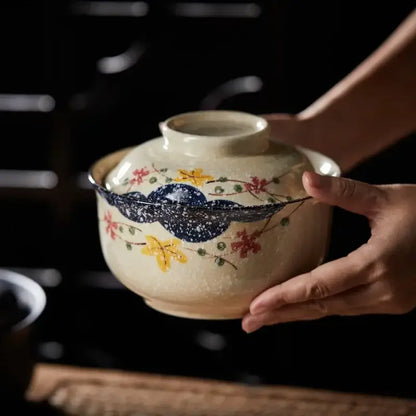 Hand-painted japanese style ceramic ramen bowl with cream base floral patterns and dark blue speckled band by decorbites japanese style