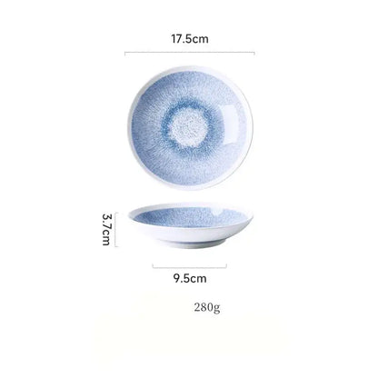 Japanese style blue and white ceramic deep dish bowl with a soft radial brushstroke pattern and smooth white rim