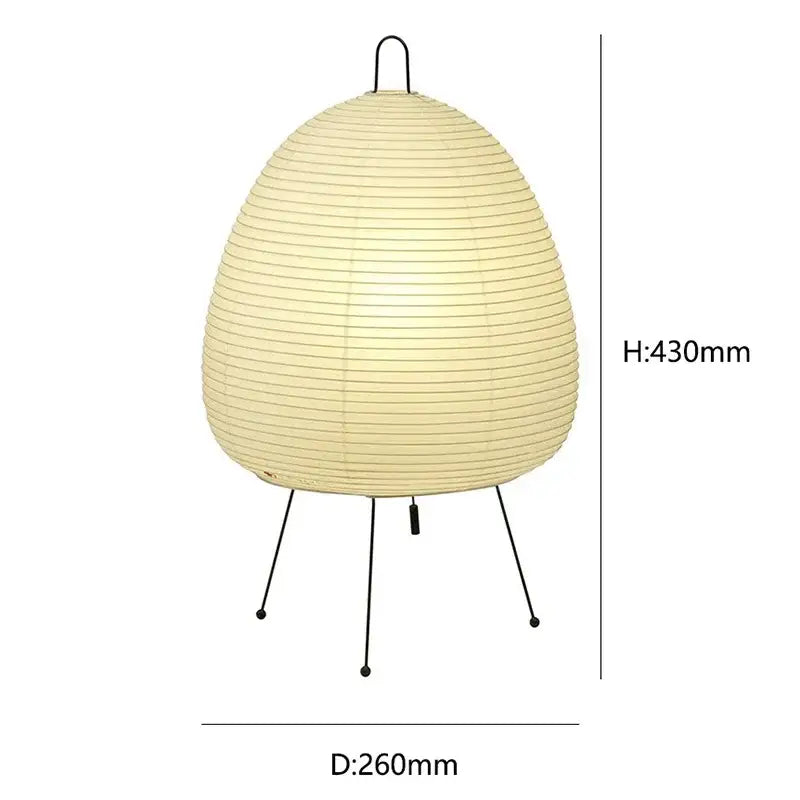 Cream-colored japanese style rice paper desk lamp with black metal tripod base and hanging loop for bedroom lighting