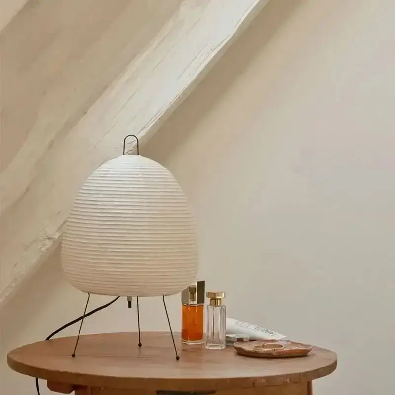 Off-white ribbed japanese style rice paper table lamp with minimalist metal stand for bedroom decorbites japanese style