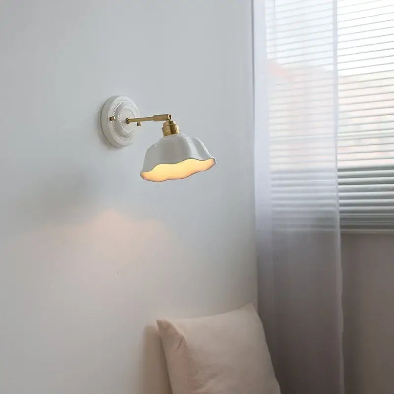 Japanese vintage white ceramic led wall sconce with brass-finished arm and decorative fluted base for bedroom decorbites ceramic led wall