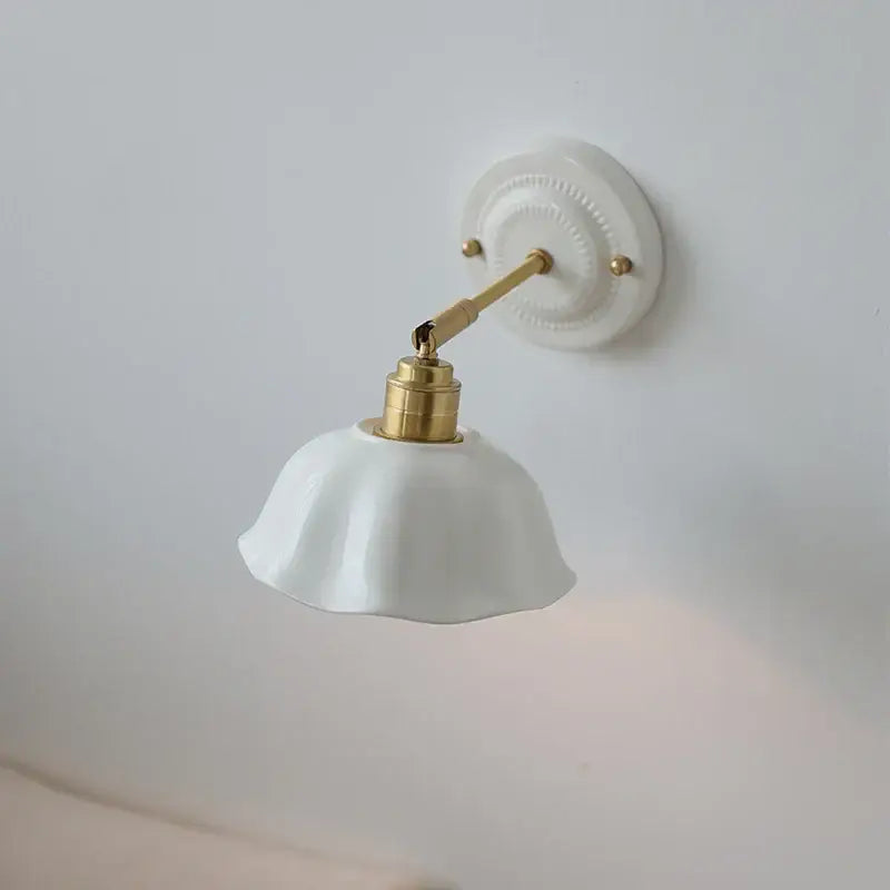Japanese vintage white ceramic led wall sconce with gold-toned metal arm for bedroom decorbites ceramic led wall lighting