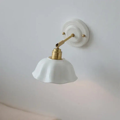 Japanese vintage white ceramic led wall sconce with gold-toned metal arm for bedroom decorbites ceramic led wall lighting