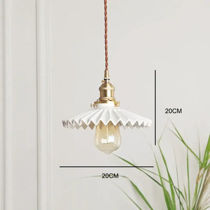 Japanese white fluted ceramic pendant light with polished copper finish and exposed edison bulb for kitchen lighting