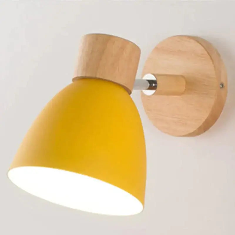 Yellow conical joan wooden reading wall sconce with natural wood base and mounting plate for bedroom lighting